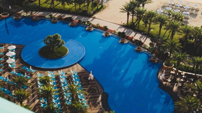 A large swimming pool near the luxury hotel