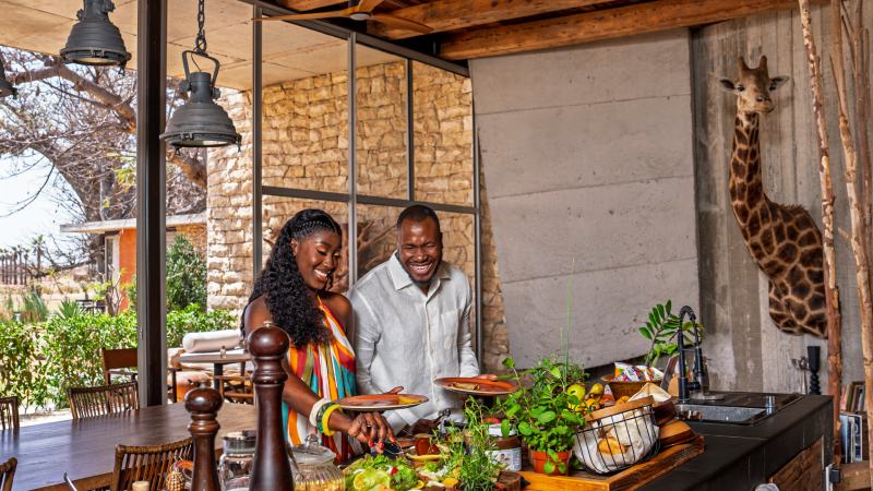 Couple enjoying a dining experience at a safari lodge