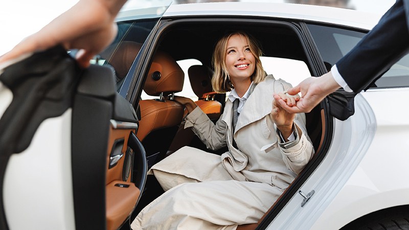 A woman getting out of the car