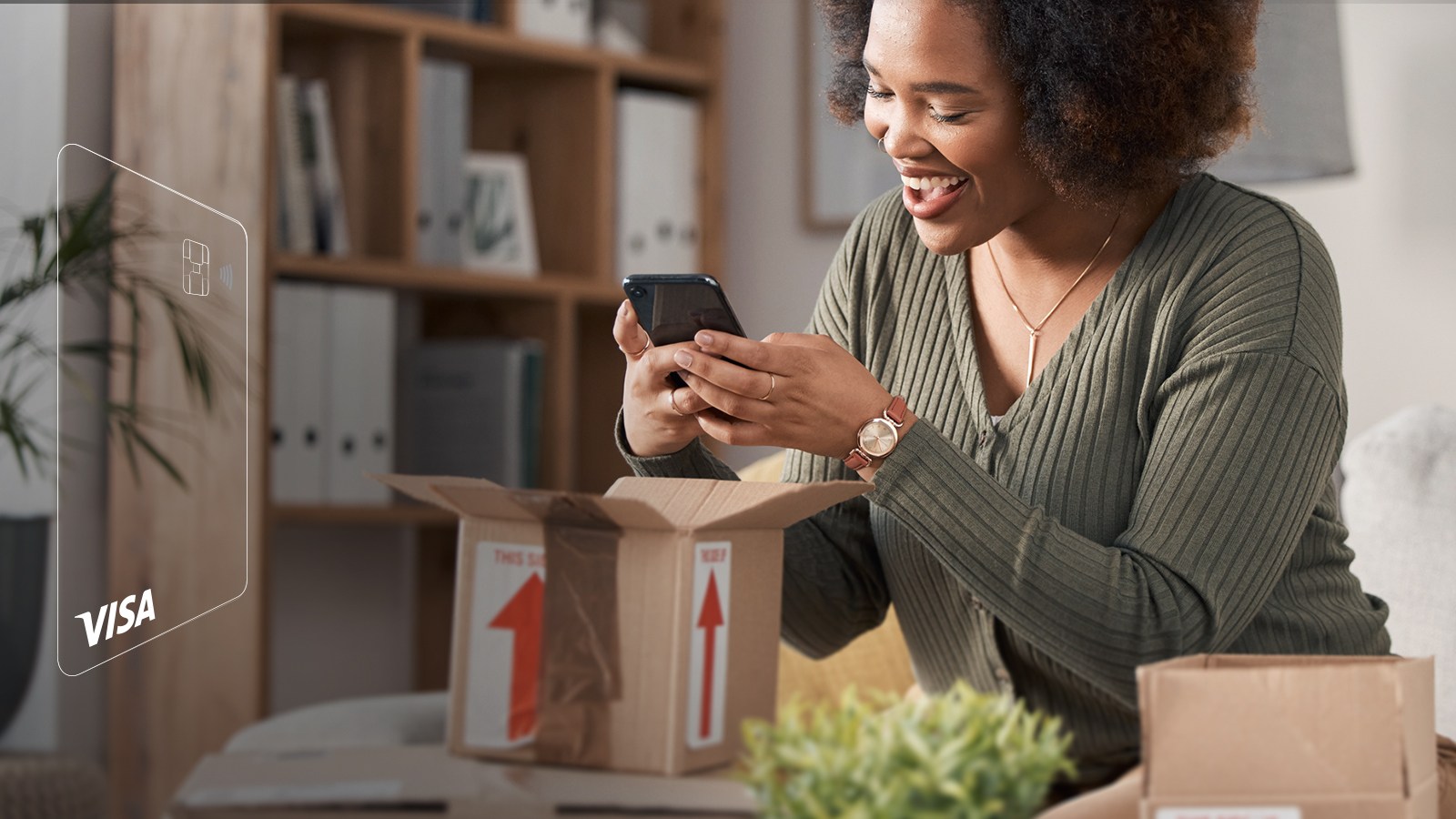 Woman unpacking parcel and making a photo of it