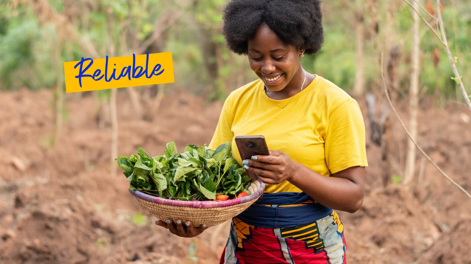 A smiling woman holding a bowl with veggies and looking at her phone. Text on the image: Reliable