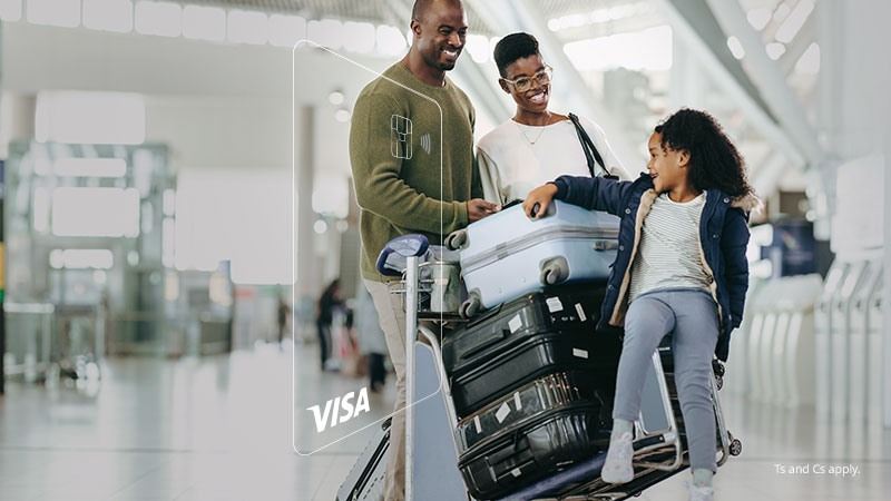 A family of three in the airport with lots of suitcases