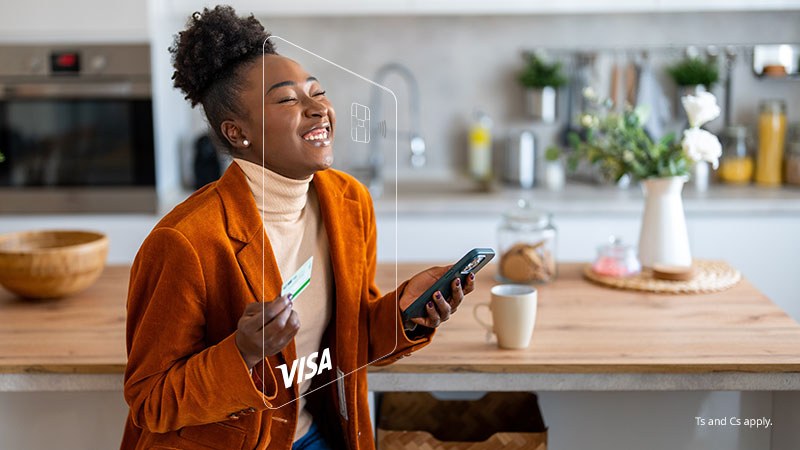 A laughing woman holding a smartphone