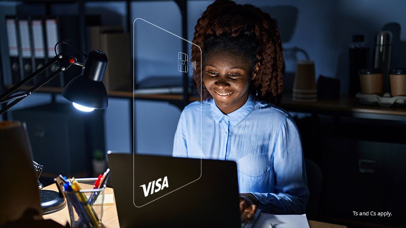 A woman working at night on her laptop