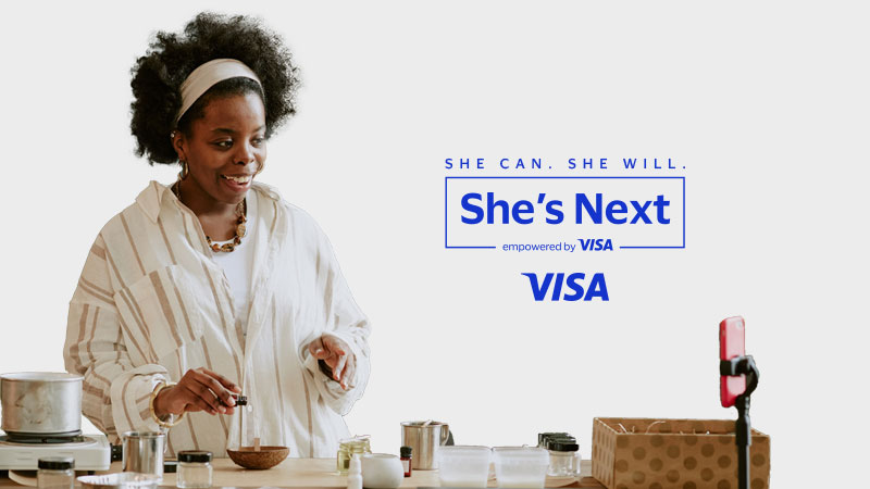 A female entrepreneur films a video of herself making a product